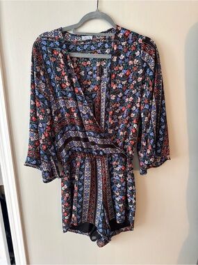 Abbeline Black Floral Romper with Red and Blue Accents